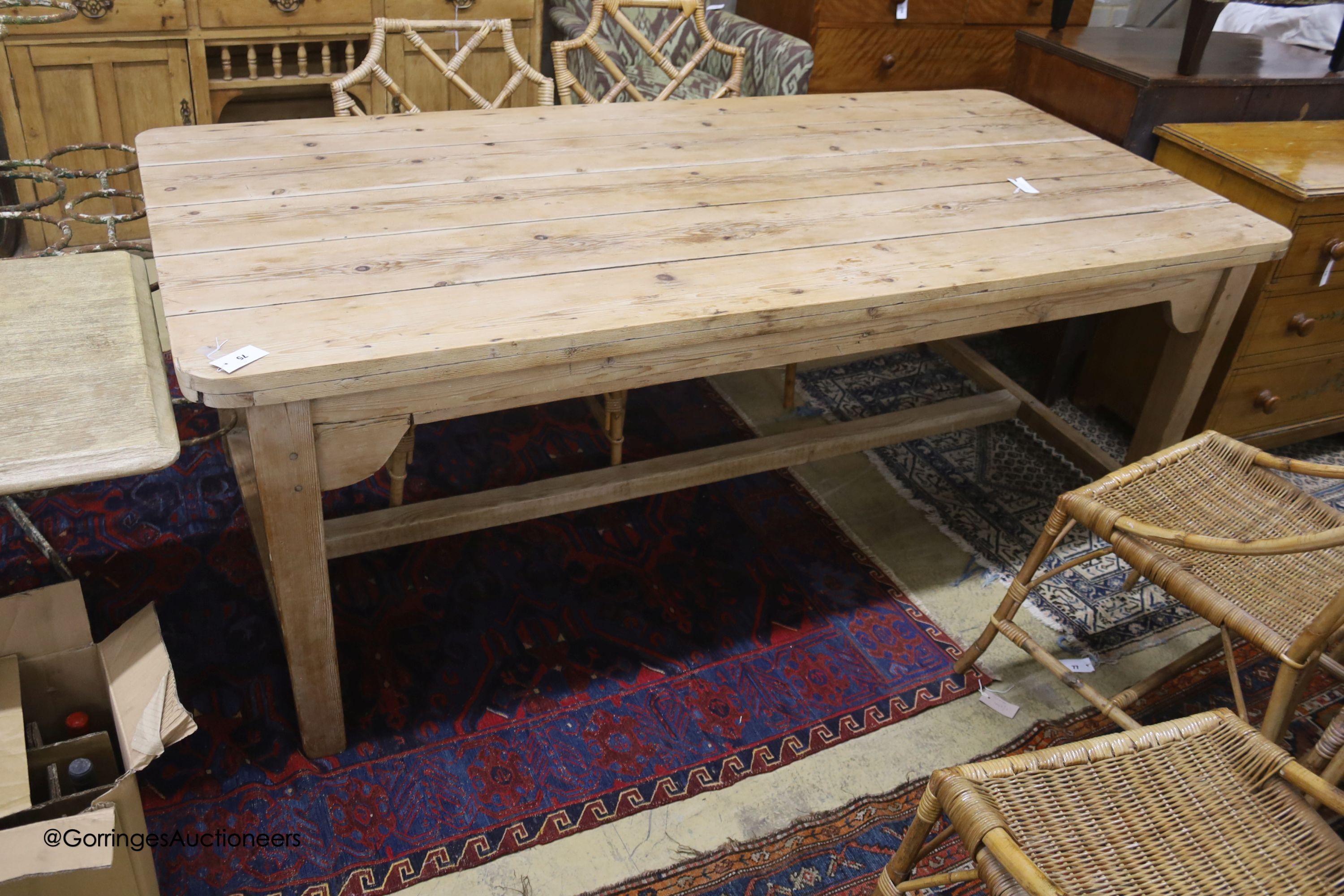 A 19th century rectangular pine plank top farmhouse kitchen table, length 211cm, depth 98cm, height 75cm